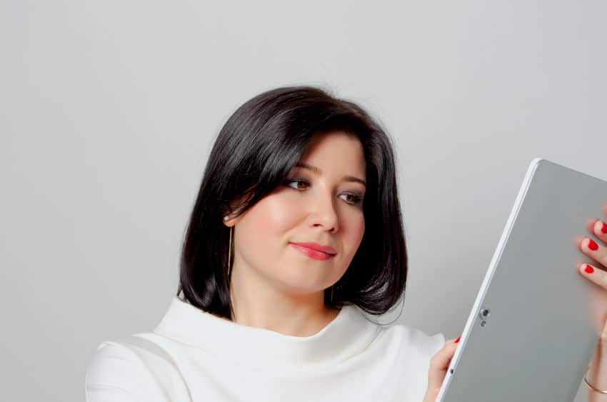 woman looking at her ipad