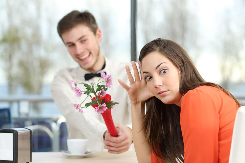 guy seeing a girl and giving her flowers