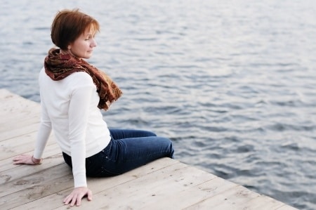 alone woman on dock