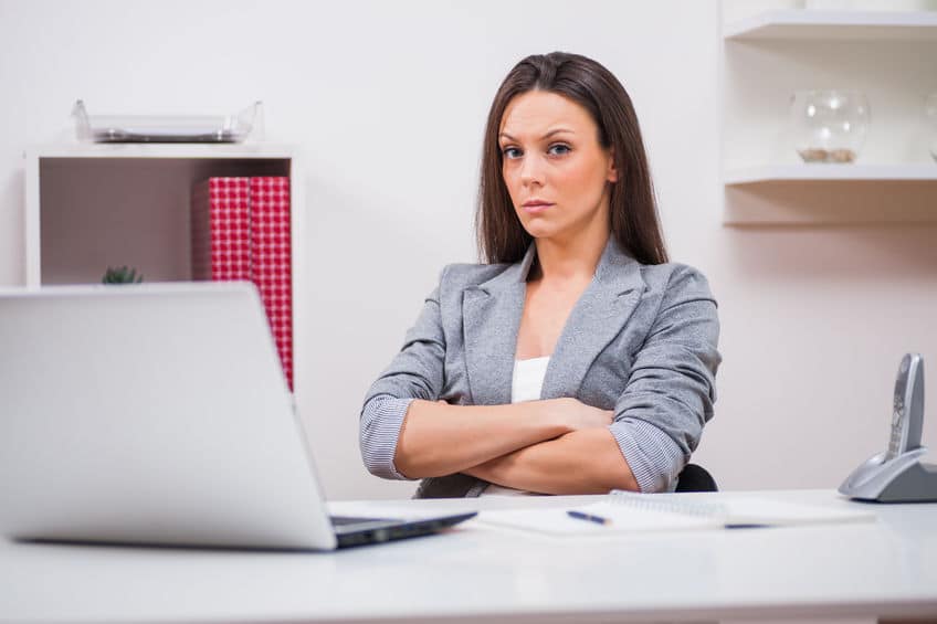 woman frowning in front of her laptop