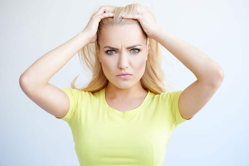 angry woman holding her hair back