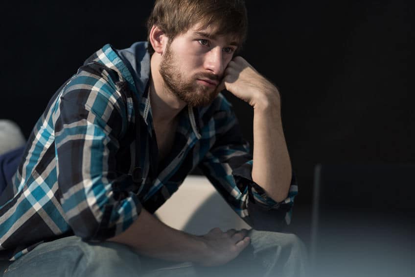 young man thinking deeply