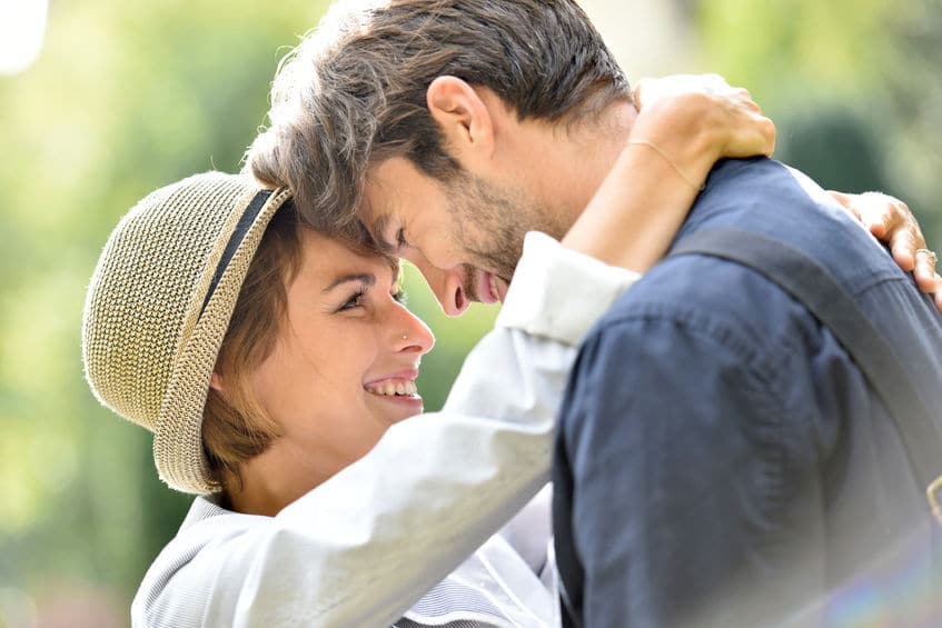 sweet young couple close together, forehead-to-forehead