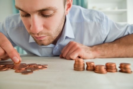 man counting his coins