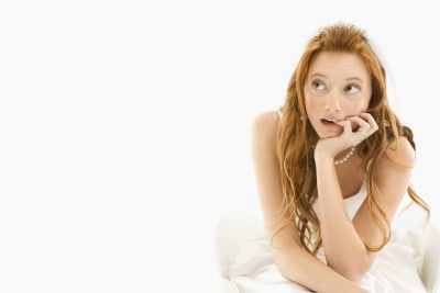 bride biting her finger, looking at the upper side