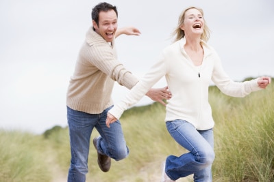 man trying to catch his wife as they run