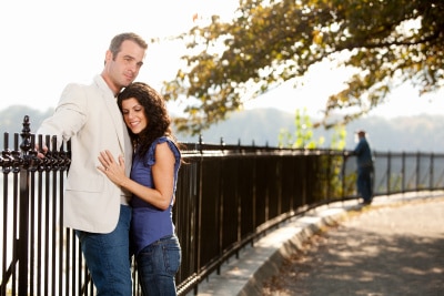 couple hugging in the park on a path