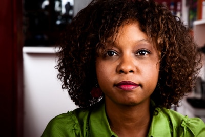 Pretty African American Woman in Bright Green Blouse