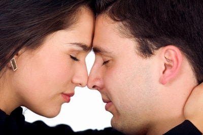 couple freaming together with eyes closed and facing each other