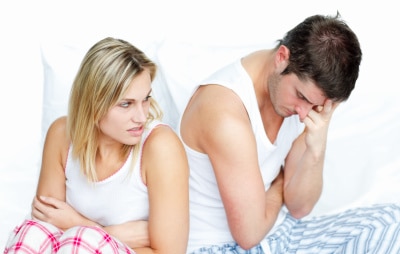 young couple on the bed, arguing