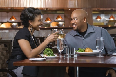 African-american couple having a wine toast