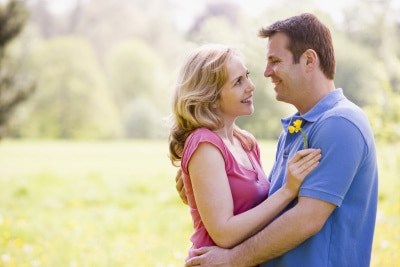 middle-aged couple looking at each other while embracing