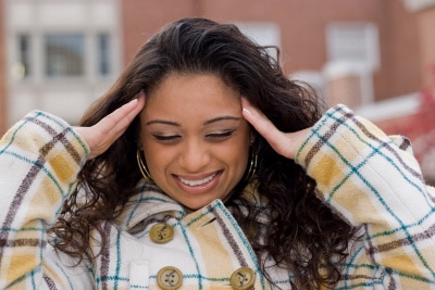 a woman suffering from an intense headache