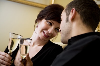 couple drinking wine, face positioned close