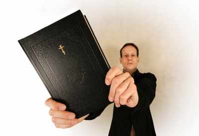 a religious man holding a bible