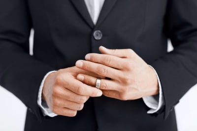 man wearing a wedding ring