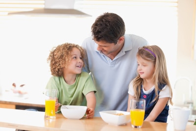 a father spending time with his children on the table