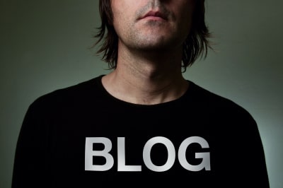 a man in black blog shirt