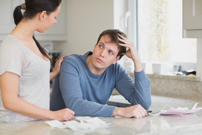 Two people in the kitchen are calculating the financial business