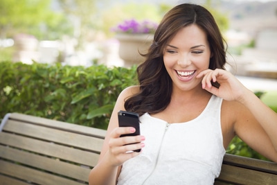 Young Adult Female Texting on Cell Phone