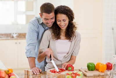 Handsome man cooking with his girlfriend