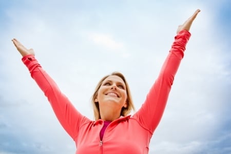 happy woman wearing pink long sleeve