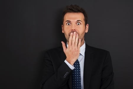 wimpy man wearing black suit