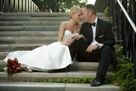 newly married couple sitting on the stairs