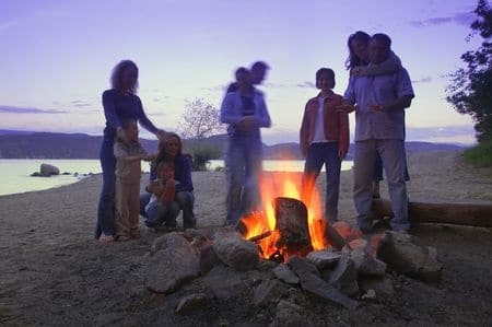 family having a camp fire