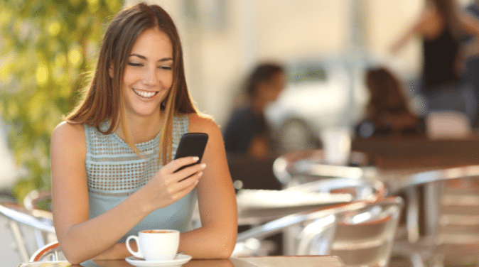 Girl Texting at Lunch Table