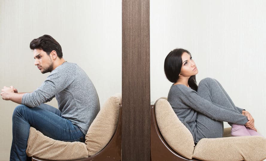 man and woman wearing gray clothes thinking about changing their behavior and get better at compromise