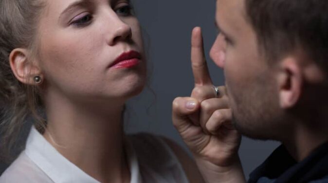 angry woman with red lipstick pointing to his boyfriend