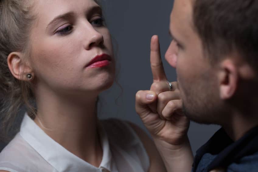 angry woman with red lipstick pointing to his boyfriend