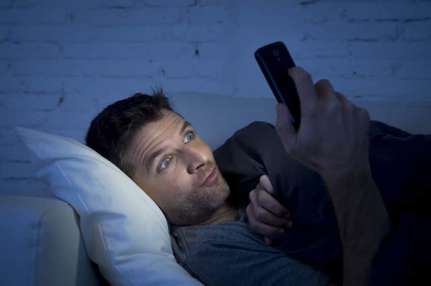 guy watching porn on his cellphone