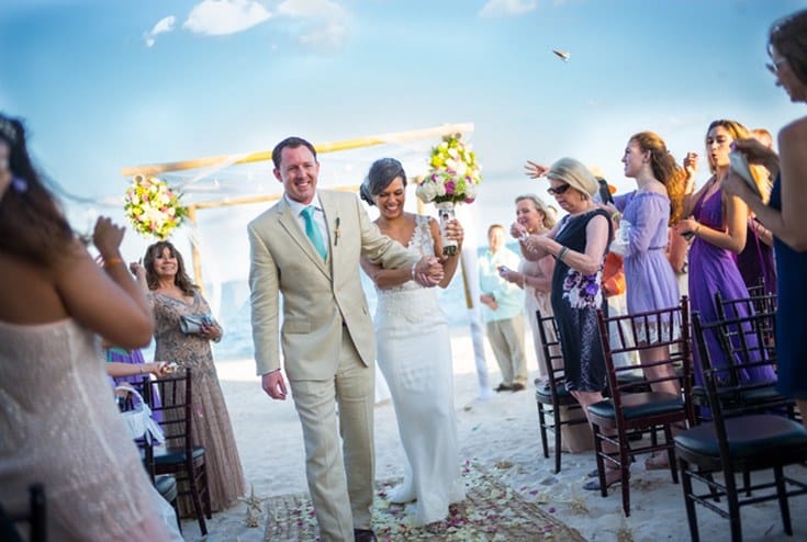 newly married couple walking down the aisle