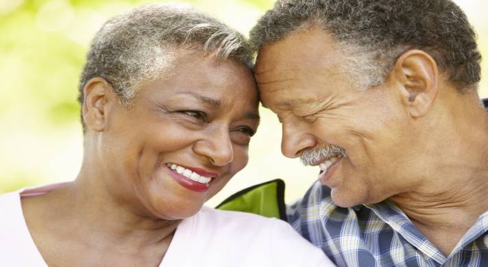 Senior couple with a happier marriage smiling at each other.