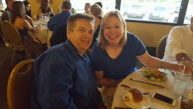 matching couple in royal blue eating together