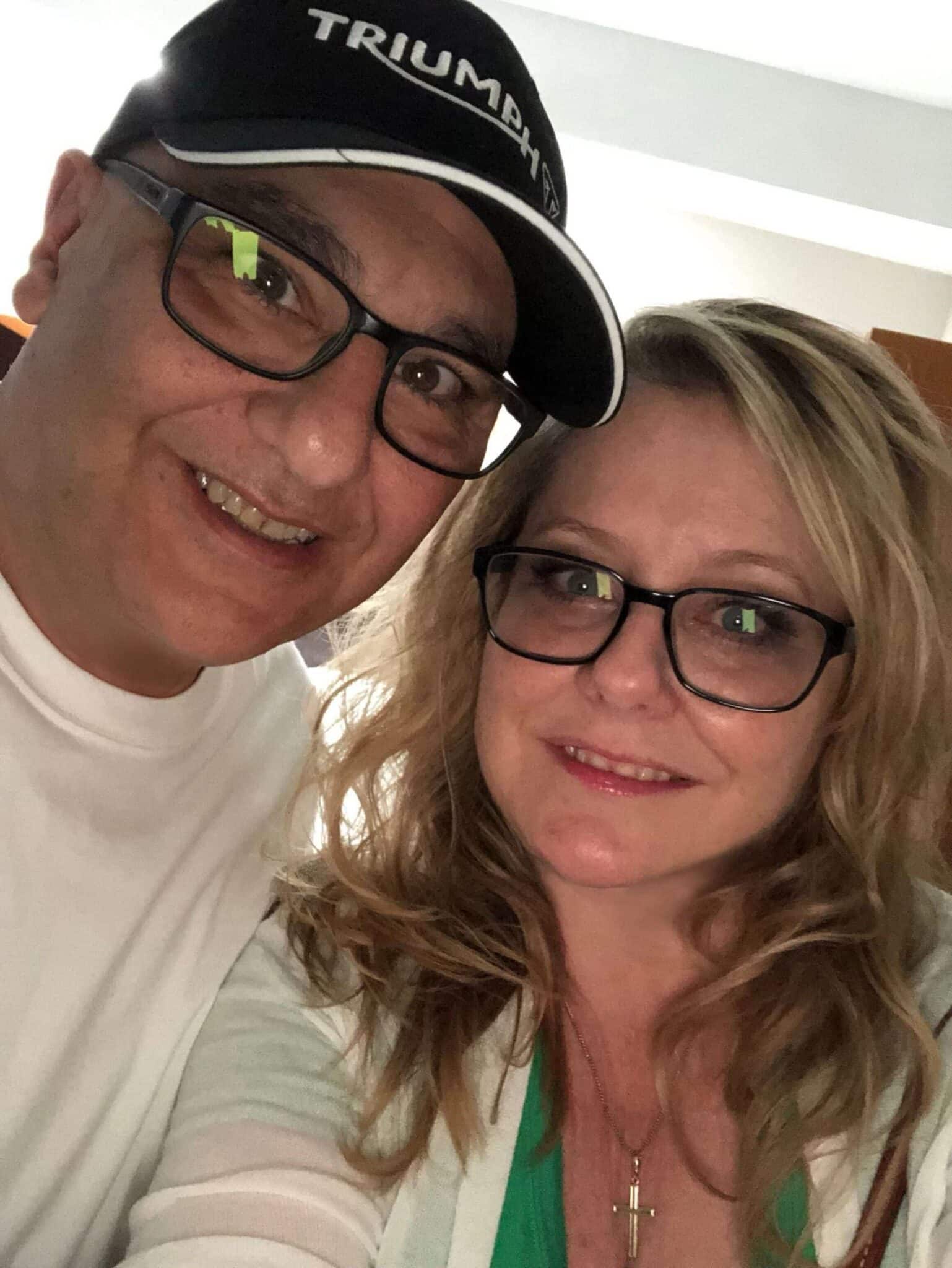 happy couple wearing glasses taking a selfie