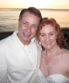 newly-wed middle-aged couple enjoying the beach scene