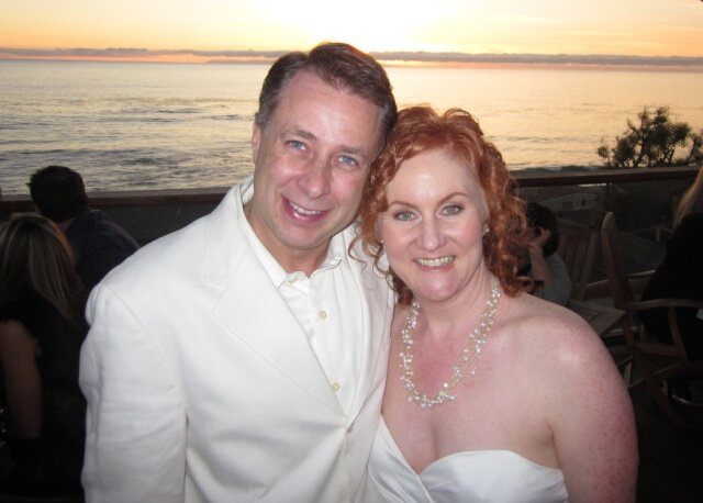 newly-wed middle-aged couple enjoying the beach scene