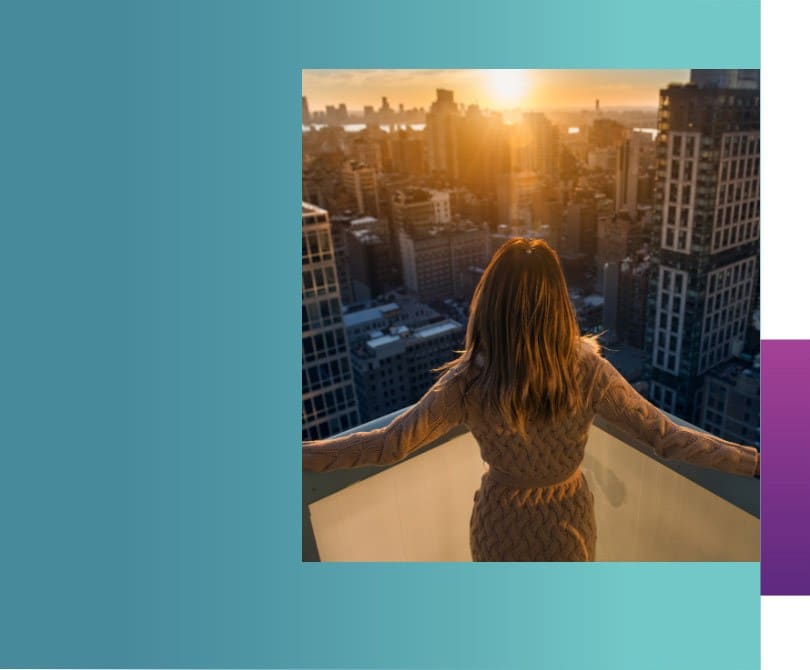 a woman on rooftop enjoying the view of beautiful sunset